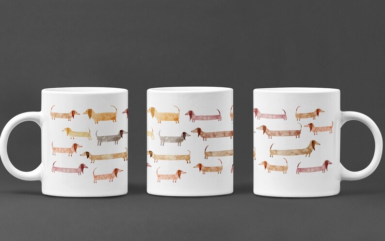May include: Three white ceramic mugs with a repeating pattern of watercolor dachshunds in various shades of brown, orange, and beige.
