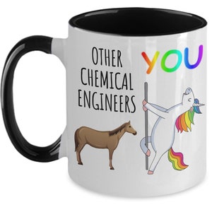 May include: White ceramic mug with a black handle and black rim. The mug has a graphic of a unicorn dancing on a pole with the text "You" in rainbow colors. Below the unicorn is a brown horse with the text "Other Chemical Engineers".
