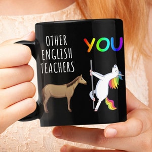 May include: Black ceramic mug with the text "OTHER ENGLISH TEACHERS" and "YOU" in rainbow colors. The mug features a brown horse and a unicorn pole dancing. A fun gift for English teachers.