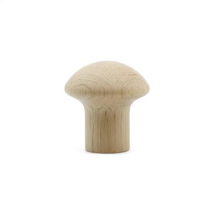 May include: A single, unfinished wooden mushroom-shaped knob. The knob has a rounded top and a cylindrical stem. The wood grain is visible, and the knob is set against a white background. This item is suitable for furniture or craft projects.