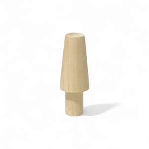 May include: A light-coloured, wooden decorative object with a cylindrical base and a conical top. The object is a natural wood colour and stands upright against a white background. The design is simple and minimalist.