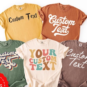 May include: Five t-shirts in various colours, including yellow, brown, green, cream, and brown, each bearing the words "Custom Text". The text is displayed in different fonts and colours. A red sticker with "Fast Delivery" is in the bottom left corner.