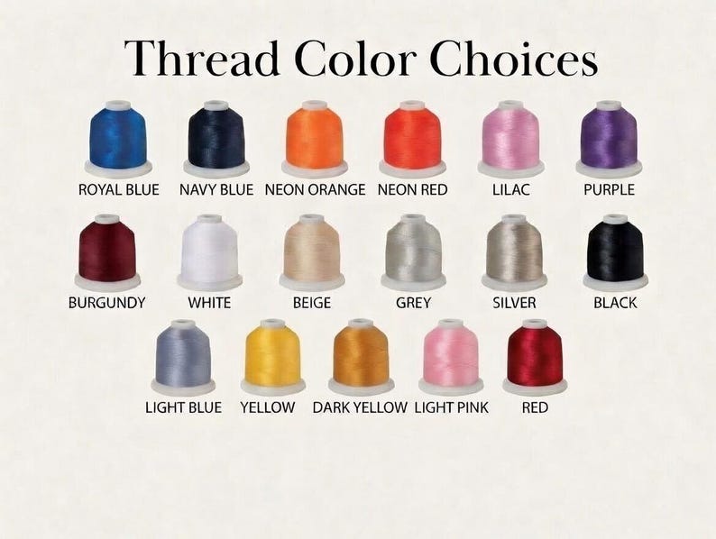 May include: An image showcasing a selection of thread color choices. The image displays spools of thread in various colors, including royal blue, navy blue, neon orange, neon red, lilac, purple, burgundy, white, beige, grey, silver, black, light blue, yellow, dark yellow, light pink, and red.