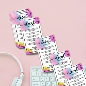 May include: A stack of five colorful cards with the word "decal" and "application" printed on them. The cards have a watercolor background with pink, blue, and yellow colors. The cards provide instructions on how to apply decals.