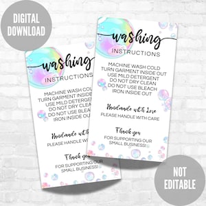 May include: Two printable washing instructions cards with a bubble theme. The cards are white with a light blue and pink bubble design. The text on the cards reads "washing instructions" and includes instructions for machine washing, drying, and ironing. The cards also include the text "Handmade with Love" and "Thank you for supporting our small business!"