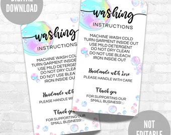 May include: Two printable washing instructions cards with a bubble theme. The cards are white with a light blue and pink bubble design. The text on the cards reads "washing instructions" and includes instructions for machine washing, drying, and ironing. The cards also include the text "Handmade with Love" and "Thank you for supporting our small business!"