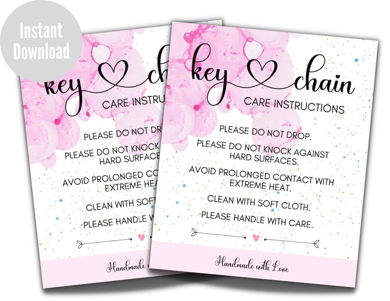 May include: Two pink and white watercolor cards with the text "key chain" and "key" with a heart symbol. The cards have care instructions for the keychain, including "Please do not drop", "Please do not knock against hard surfaces", "Avoid prolonged contact with extreme heat", "Clean with soft cloth", and "Please handle with care". The cards also say "Handmade with Love".