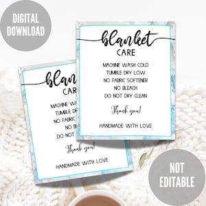 May include: Two printable care instructions cards for blankets. The cards have a blue and white marble background with black text. The text on the cards reads "blanket care" and includes instructions for washing and drying the blanket. The cards also include the text "Handmade with love" and "Thank you!"