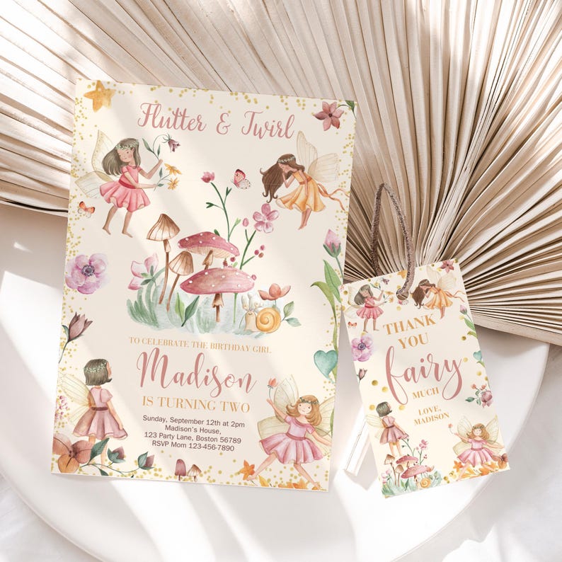 May include: A pink and gold fairy-themed birthday party invitation with a watercolor illustration of fairies, mushrooms, and flowers. The invitation says "Flutter & Twirl" and "Madison is turning two". It includes the date, time, and location of the party. A matching thank you tag says "Thank you fairy much, Love Madison".