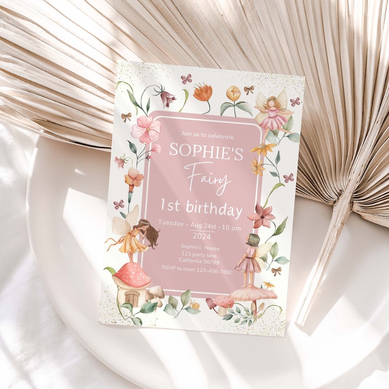 May include: A pink and white invitation card with a floral border and a fairy illustration. The text reads "Join us to celebrate Sophie's Fairy 1st birthday. Tuesday Aug 24st - 10 pm 2024. Sophie's House 123 party lane California 56789. RSVP to mom 123-456-7890."