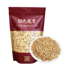 May include: A bag of Royal Seafood USA snacks with a clear window, filled with light brown, oval-shaped food items. A white plate to the right is filled with the same snacks. The bag has a red and gold design with Chinese characters.