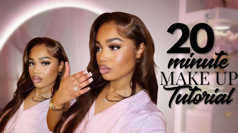May include: A woman with long, wavy brown hair and full makeup is featured in a beauty tutorial. The text "20 minute MAKE UP Tutorial" is displayed in black script. She wears a pink striped shirt and jewelry.
