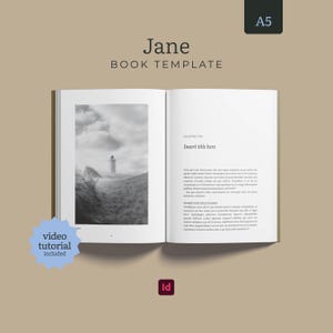 May include: An A5 book template titled Jane, featuring an open book layout with a black and white photograph of a lighthouse on the left page and placeholder text under the heading Insert title here on the right page, with a video tutorial included.