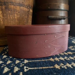 May include: A rustic wooden sign with the text "Welcome to our home" in white lettering. The sign features a distressed finish and a simple, inviting design, perfect for a front porch or entryway.