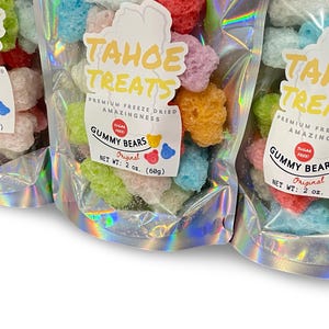 May include: Three bags of freeze-dried gummy bears in assorted colors. The bags are labeled "Tahoe Treats" and "Gummy Bears Original" with a net weight of 2 oz (60g).