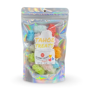 May include: A bag of freeze-dried gummy bears in assorted colors. The bag is iridescent and has a label that says "Tahoe Treats" and "Gummy Bears Original". The net weight is 2 oz (60g).