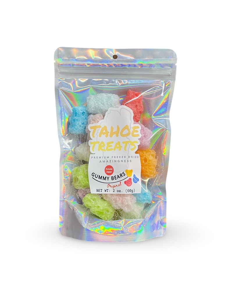 May include: A bag of freeze-dried gummy bears in assorted colors. The bag is iridescent and has a label that says "Tahoe Treats" and "Gummy Bears Original". The net weight is 2 oz (60g).