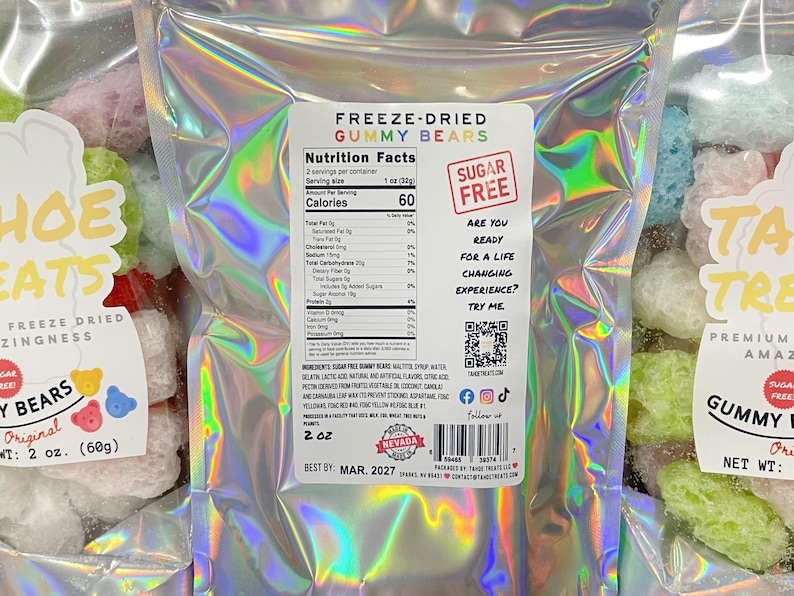 May include: A bag of freeze-dried gummy bears with a holographic iridescent finish. The bag is labeled "Freeze-Dried Gummy Bears" and "Sugar Free". The nutrition facts are listed on the back of the bag. The bag is 2 oz (60g).