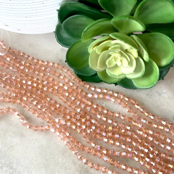 6mm x 5.5mm Bicone Rose Gold Pink Iridescent Crystal Glass Bead 11 inch strand / Approx 45 beads / Rondelle bead /Glass Faceted