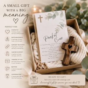 May include: A brown cardboard gift box containing a wooden cross with a small heart cutout and a white card featuring a cross icon, eucalyptus leaves, and the text Pocket Cross, along with a poem about faith, hope, and strength.