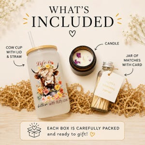 May include: A frosted glass tumbler with a bamboo lid and straw, featuring a cow and floral graphic with the text Life is better with fluffy cows. Includes a small candle in a dark jar and a glass bottle of matches with a tag reading A little something for you.