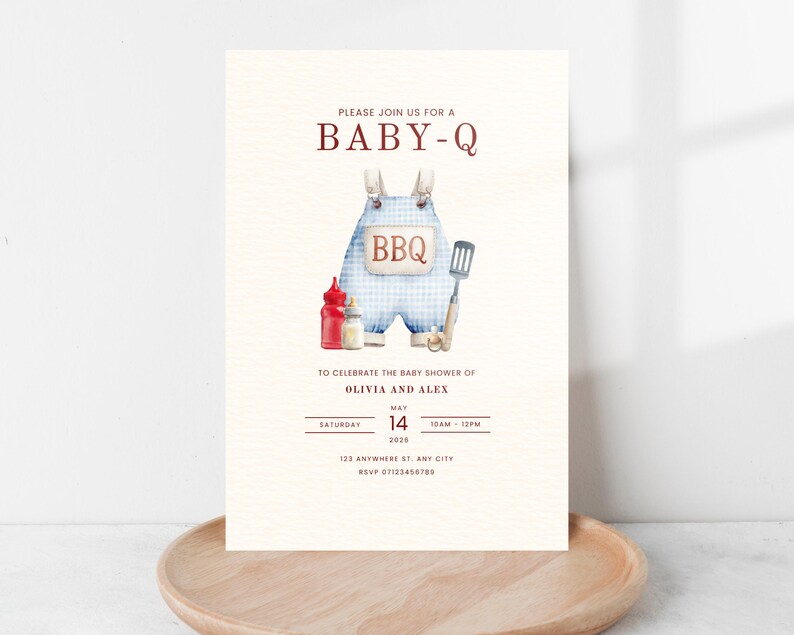 May include: Baby shower invitation with a watercolor illustration of blue gingham overalls with the word "BBQ". The invitation includes the text "PLEASE JOIN US FOR A BABY-Q" and details for Olivia and Alex's baby shower.