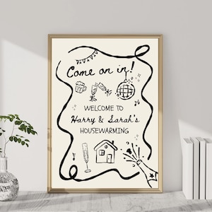May include: A framed housewarming sign with the text "Come on in!" and "Welcome to Harry & Sarah's Housewarming". The black and white illustration includes celebratory icons like champagne, a disco ball, and a house.