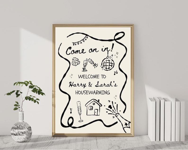 May include: A framed housewarming sign with the text "Come on in!" and "Welcome to Harry & Sarah's Housewarming". The black and white illustration includes celebratory icons like champagne, a disco ball, and a house.