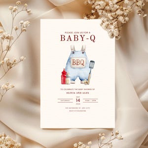 May include: Baby shower invitation with the text "PLEASE JOIN US FOR A BABY-Q". The invitation features a watercolor illustration of blue gingham overalls with the word "BBQ" on them, along with condiments and a spatula.