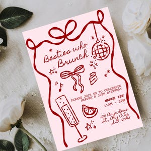 May include: A pale pink invitation card with burgundy illustrations and text. The text reads "Besties who Brunch" and includes details for a 30th birthday celebration. The invitation features a ribbon design, disco ball, and champagne flute.
