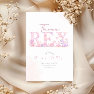 May include: A handmade wooden sign with the text "Welcome" in a playful font. The sign is painted white with a distressed finish, and features a decorative floral design in shades of pink and green. It measures approximately 12 inches wide.
