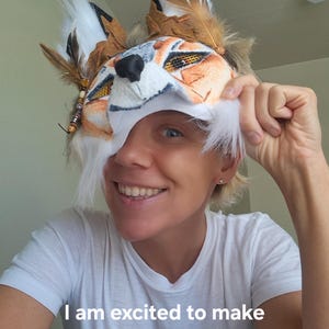 The artist of the therian coyote mask, Forest, showing the wearability
