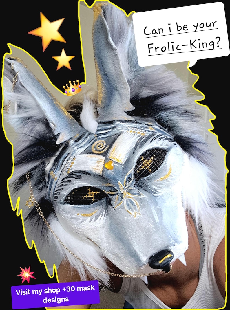 Hi there! Frolic-King is a majestic spirited therian mask full of pride. Frolic-King is a coyote theriotype. You could customize his style to another theriotype, such as a fox. this mask is a monochromatic white and black mask. The Mask has white highlights that descend all the way to the Dark Shadows of black his eyes are black and the pupils are gold stars gold accents are overlaid on his beautiful face in pattern such as a dragonfly on his nose a swirl on his forehead. order today.