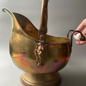 Antique brass log holder / ceramic handles / kindling holder / lionhead motif / footed bowl / vintage coal bucket / home decor display