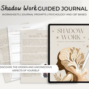 Könnte beinhalten: Ein digitales Tablet zeigt eine beige und braune Illustration eines Frauenkopfes mit einem Baum, der aus ihm herauswächst. Der Text "Shadow Work Journal and Guided Workbook" wird auf dem Bildschirm des Tablets angezeigt. Das Tablet befindet sich auf einer weißen Oberfläche mit einem weißen Stift daneben.