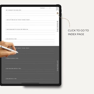 May include: A digital planner on a tablet screen with a gray background. The planner is divided into two sections: Morning and Evening. Each section has prompts for reflection and gratitude. The text "CLICK TO GO TO INDEX PAGE" is visible on the screen.