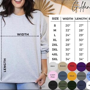 May include: A light gray Gildan 18000 sweatshirt with a size chart and color swatches. The chart lists sizes S to 5XL, with measurements in inches for width, length, and sleeve length. Color options include ash, sand, red, purple, and more.