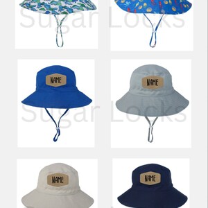 May include: Six different styles of children's sun hats with adjustable chin straps. The hats are made of a lightweight fabric and feature a brown patch with the word "NAME" printed in black.