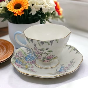 Vintage Handpainted E b foley bone china tea cup and saucer 1930&#39;s with unique floral pattern, tea party, English antique china, hollyhocks
