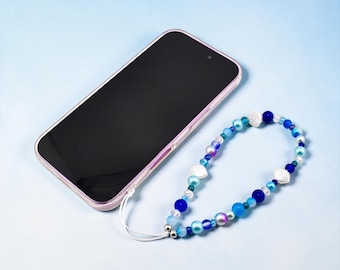 Pasek na nadgarstek z zawieszką do telefonu w kształcie muszli oceanicznej w kolorze niebieskim