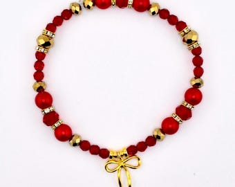 Red and Gold Beaded Bracelet with Bow Charm