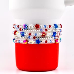 May include: A set of three ceramic mugs with a speckled, matte finish. The mugs are in shades of cream, light brown, and dark brown. Each mug has a simple, minimalist design, perfect for coffee or tea.