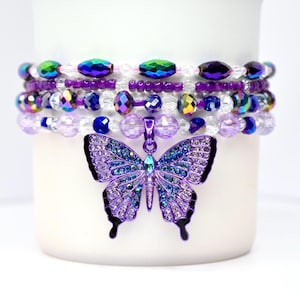 Juego de 4 pulseras con forma de mariposa morada