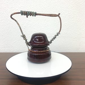 May include: A rustic wooden sign with the text "Welcome to our home" in white lettering. The sign features a distressed finish and a simple, inviting design, perfect for front door decor.