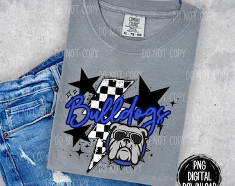 May include: A gray Comfort Colors XL t-shirt with a graphic design featuring the word "Bulldogs" in blue script, a bulldog wearing sunglasses, a black and white checkered lightning bolt, and black stars. The shirt is paired with blue denim shorts.