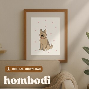 Puede incluir: Una impresión enmarcada con un perro de dibujos animados con pelaje marrón claro y gris, sentado y sonriendo. El fondo es blanco con pequeños corazones rosas. El marco es marrón. Las palabras "DESCARGA DIGITAL" y "hombodi" son visibles.