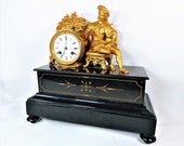 Late 19th Century Victorian Gilt Figural Black Slate Mantel Clock