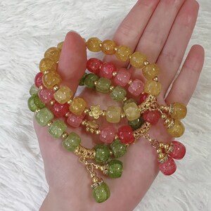 Enchanting Gemstone Bracelet Adorned with Charms: Elevate Your Style with Elegance
