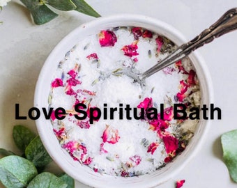 May include: A white bowl filled with bath salts, rose petals, and lavender. The text "Love Spiritual Bath" is written in black letters below the bowl.