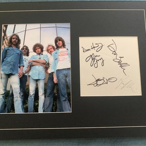 The Eagles Signed Autographed 14x18 Photo Display Don Henley, Glenn Frey, Don Felder, Randy Meisner & Joe Walsh(Not pictured).  COA